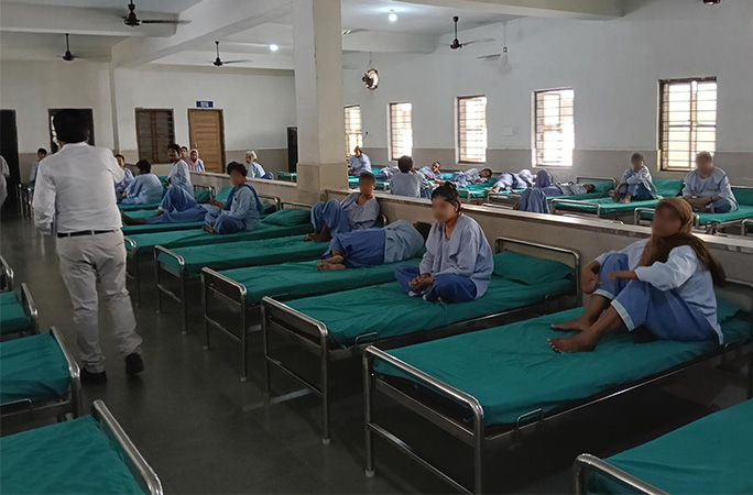 women on beds in the shelter