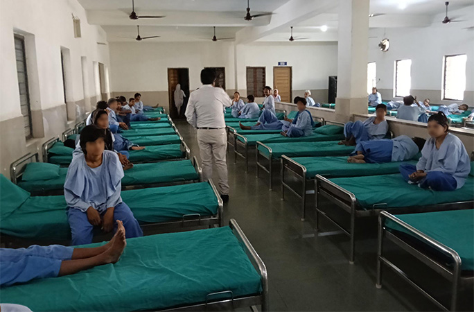 women on beds in the shelter