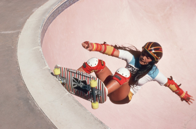 Throwback picture of Judi skating as a teen in a pink pool