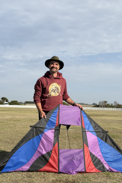 Angus holding the kite in daylight