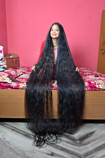 Renu's hair hanging over the bed