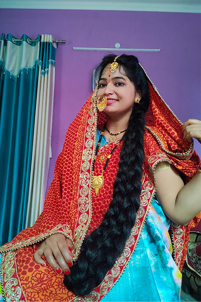 Renu with her hair in a plait