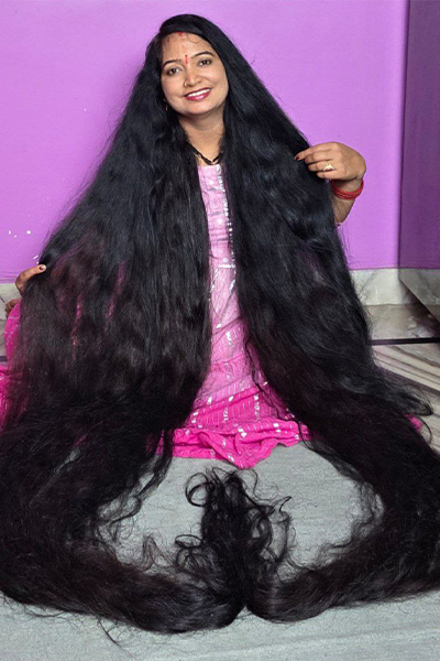 Renu sitting on the floor with her hair hanging around her