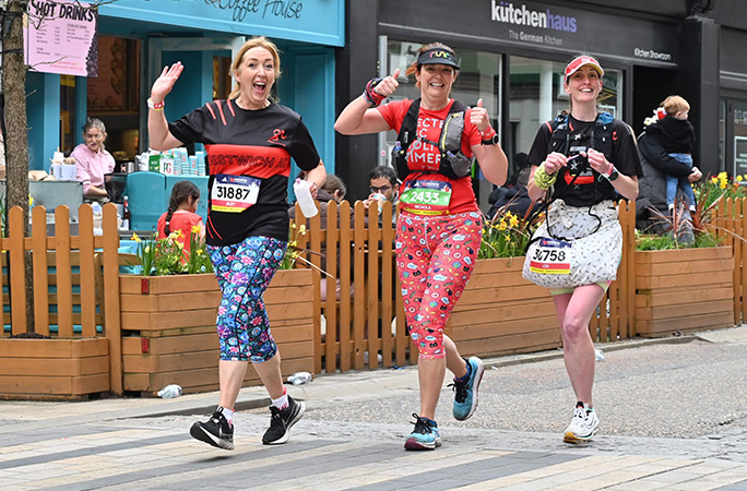 Louise Warwick running and crocheting with her two friends