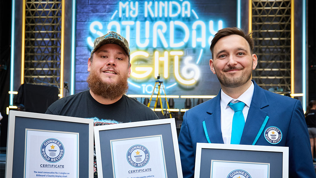 GWR's Will Munford presents Luke Combs with three certificates