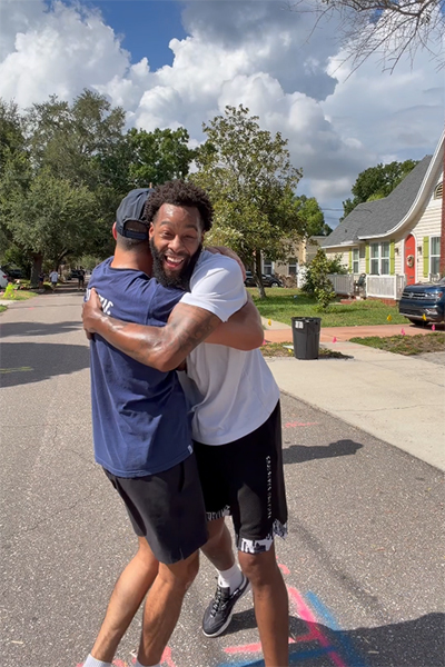 Nicholas hugging his friend after winning the record