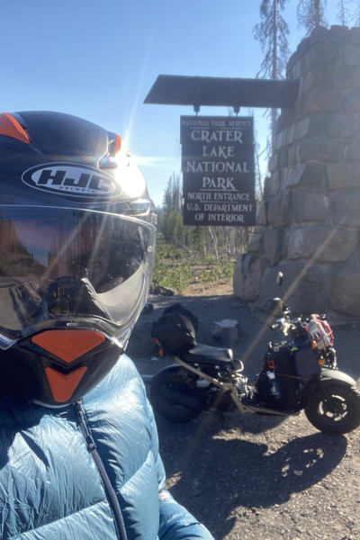 Jon taking a selfie with his moped at Crater Lake national park