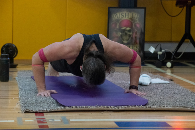 Zoomed out picture of Laura mid push up