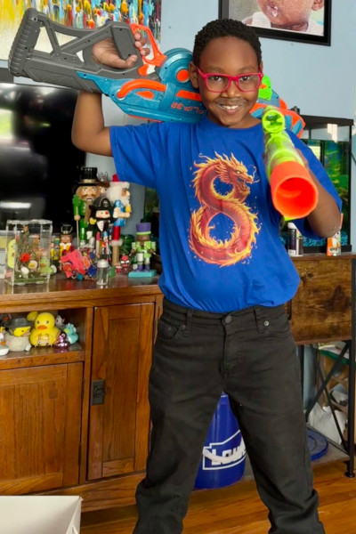 Skyler holding water guns
