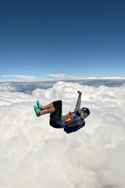 Mark-Olivier somersaulting while entering clouds in the sky
