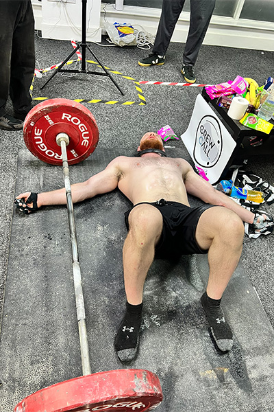 Daniel lying next to the weight