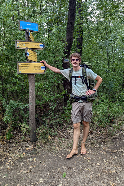 Eamonn barefoot in a forest
