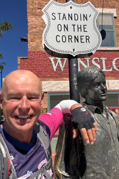 Mark taking a selfie with a sculpture of a man