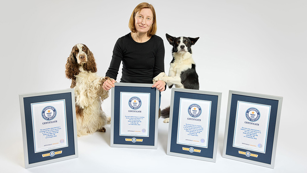 Bonnie and Simba with owner Olga Jones and some GWR certificates