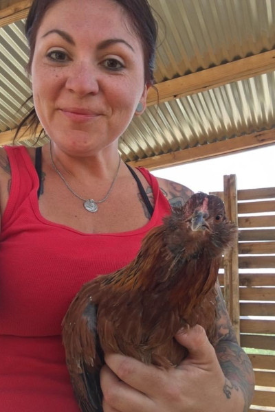Ashley holding a chicken