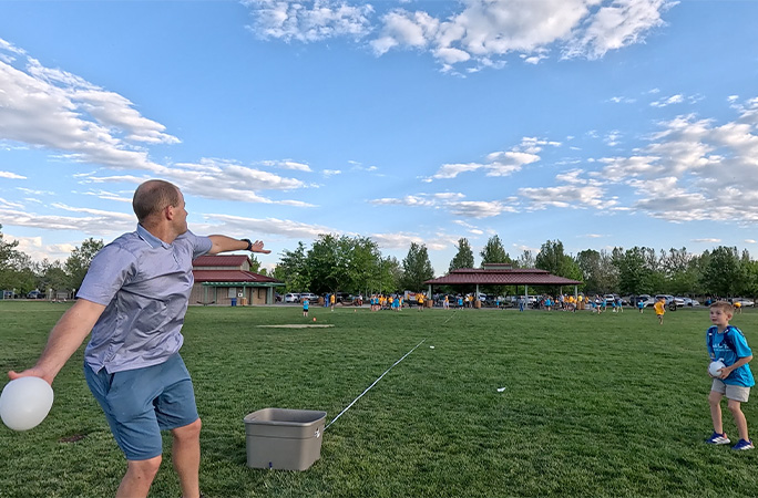 David throwing the water balloon