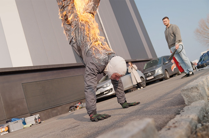 Filip on fire holding a handstand