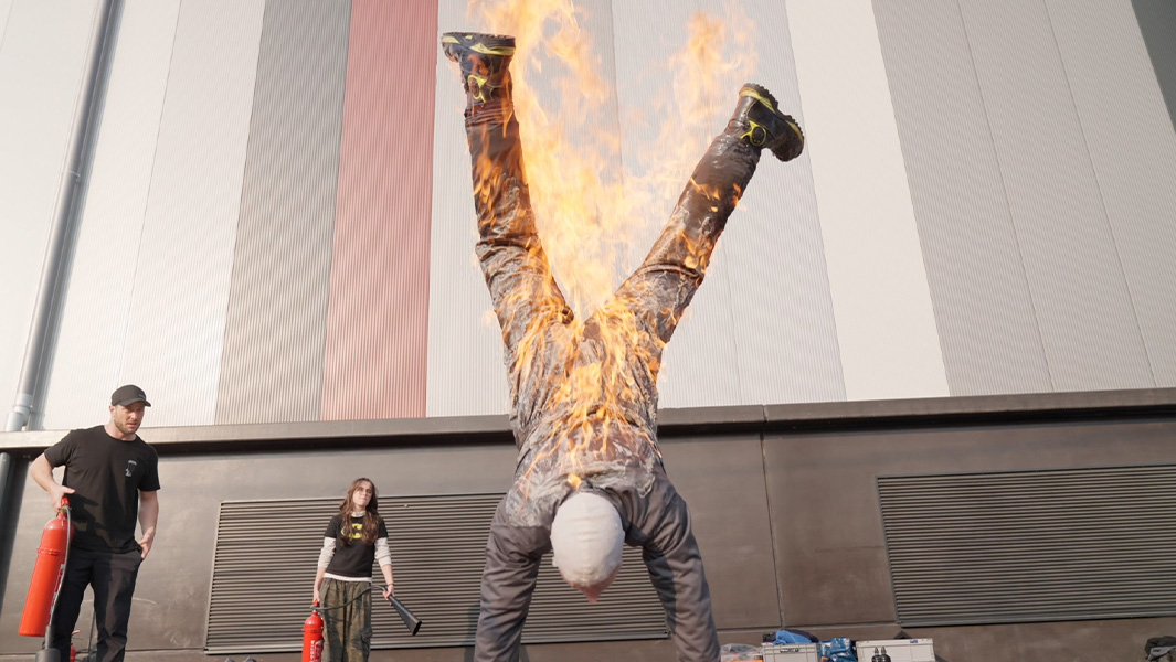 Filip performing a full body burn handstand