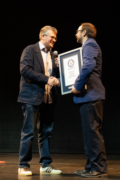 John and GWR Adjudicator shaking hands, while holding GWR certificate