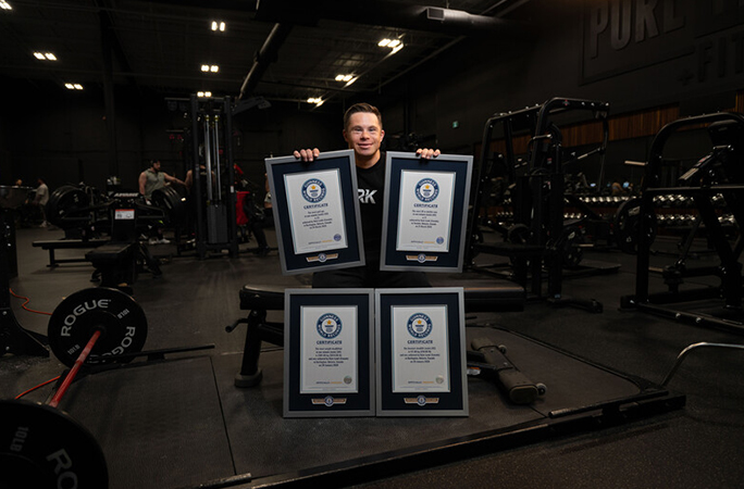 Kyle Landi with four GWR certificates in the gym
