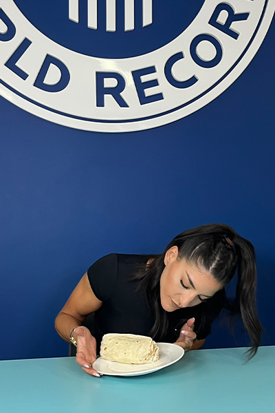 Leah looking at a burrito