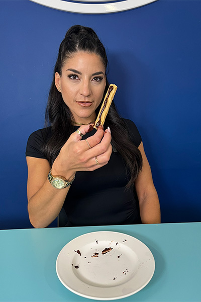 Leah holding up a churro