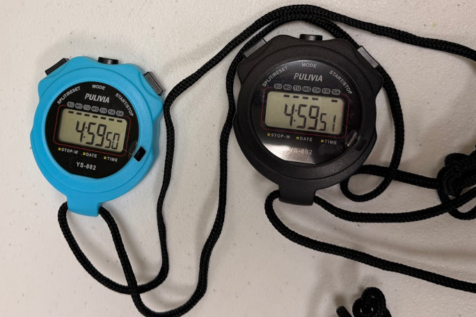 Closeup of the two stopwatches, stopped at the end of their attempt