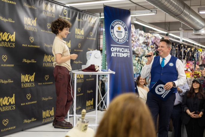 Max celebrating while Michael announces the good news