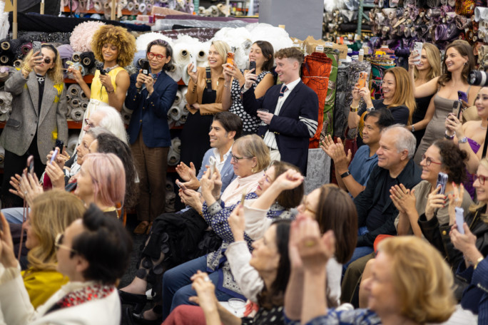 The fashionable crowd celebrating as Max receives his record