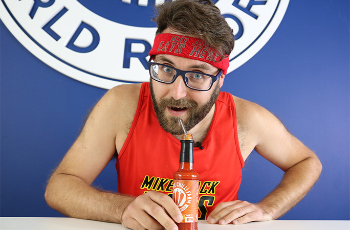 Mike drinking hot sauce