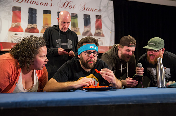 Mike eating peppers in a competition