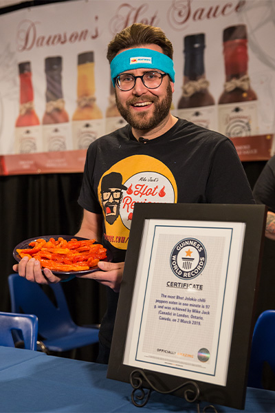 Mike holding a plate of chillies and with a GWR certificate
