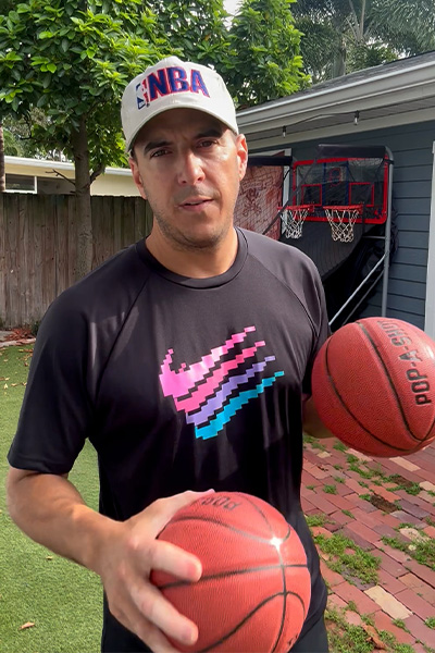 Nicky holding two mini basketballs