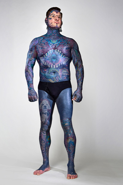 Tattooed Remy stood facing the camera