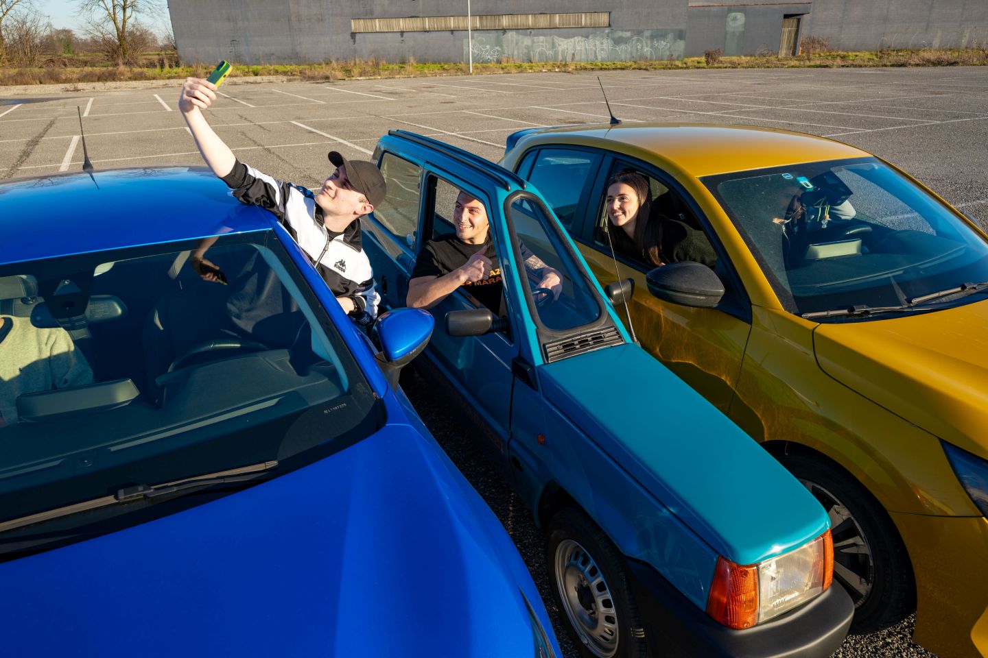 The world's narrowest car parked between two normal cars