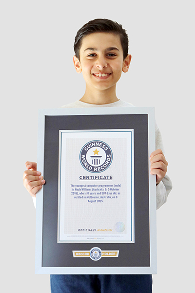 Noah holding his certificate