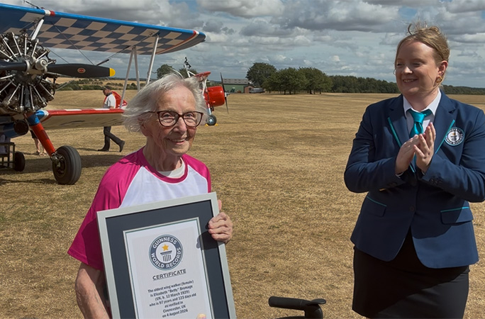 Betty being presented with her GWR certificate by Adjudicator Emma Salt
