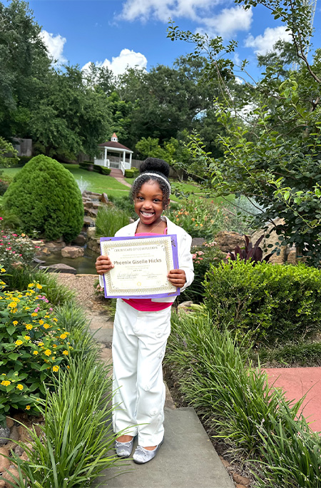 phoenix in garden with certificate