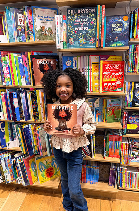 phoenix in library holding her book