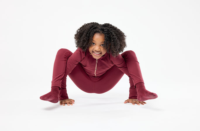 phoenix on floor doing yoga pose