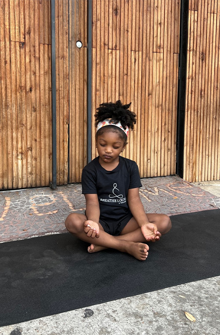 phoenix doing yoga eyes closed