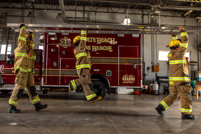 Autumn dangling on the fireladder with her feet off the ground