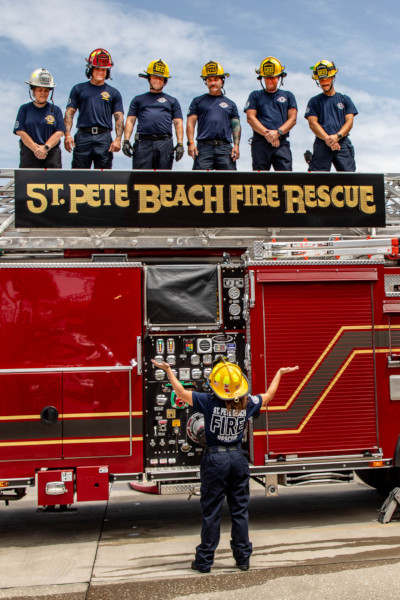 Autumn shrugging as the crew looks down on her from atop the firetruck