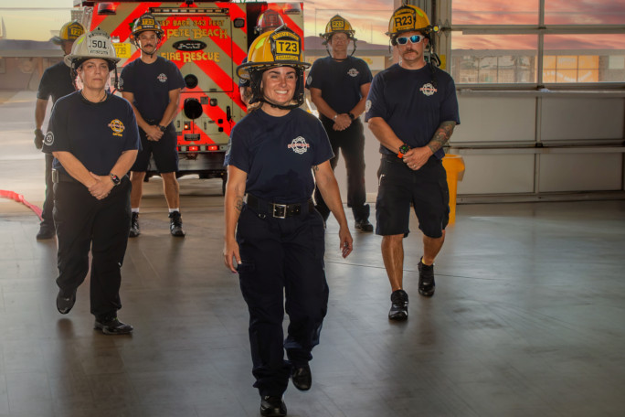 Autumn walking in front of her crew, everyone looking serious