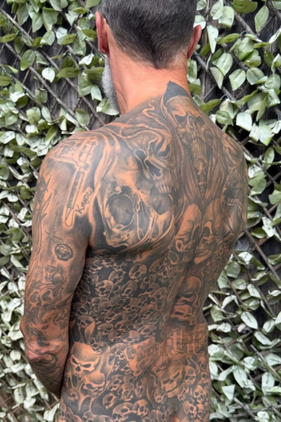 Scott showing off his back tattoos