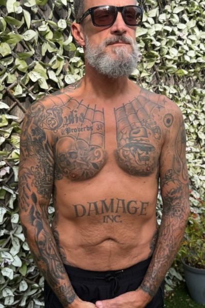 Scott's tattoos from the front, chest upwards