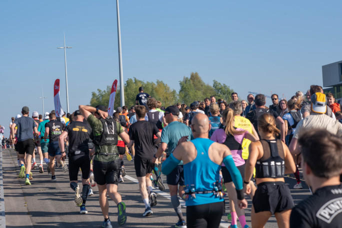 Jonathan in a pack of runners near the starting line, his head peeking above the crowd