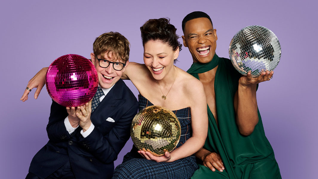 Josh Widdicombe, Emma Willis and Johannes Radebe pose with glitterballs