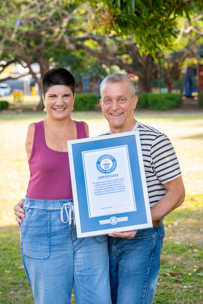wingless-warrior-kerry-lee-gockel-with-her-husband-paul-and-her-gwr-certificate