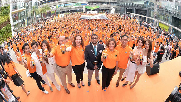 Most people opening bottles in a relay Thailand header